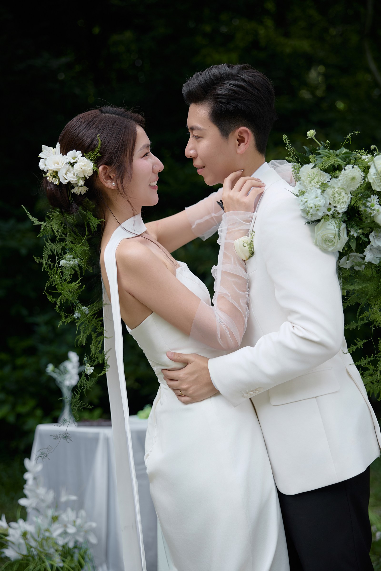 Zaw and Shwan embracing in the garden